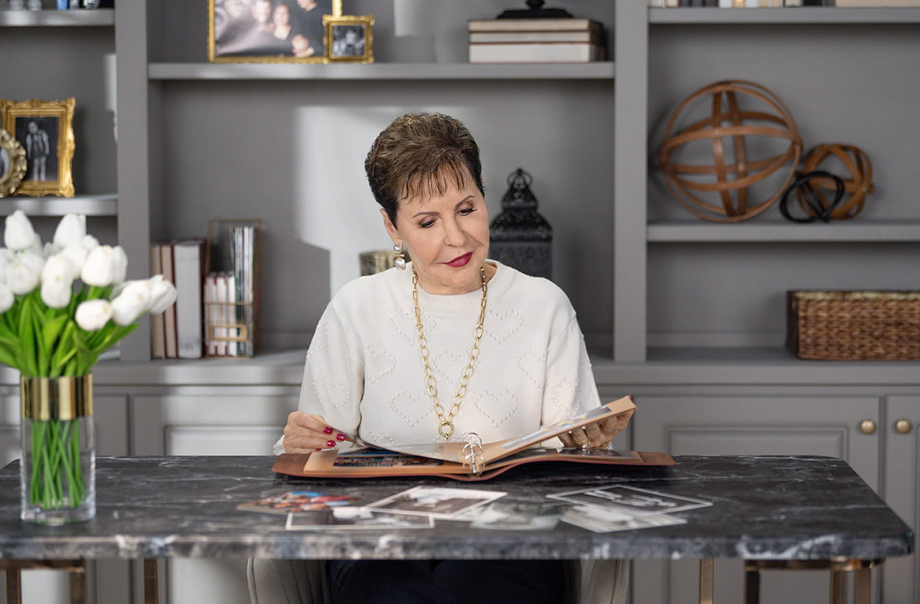 Joyce Meyer sitting reading a book